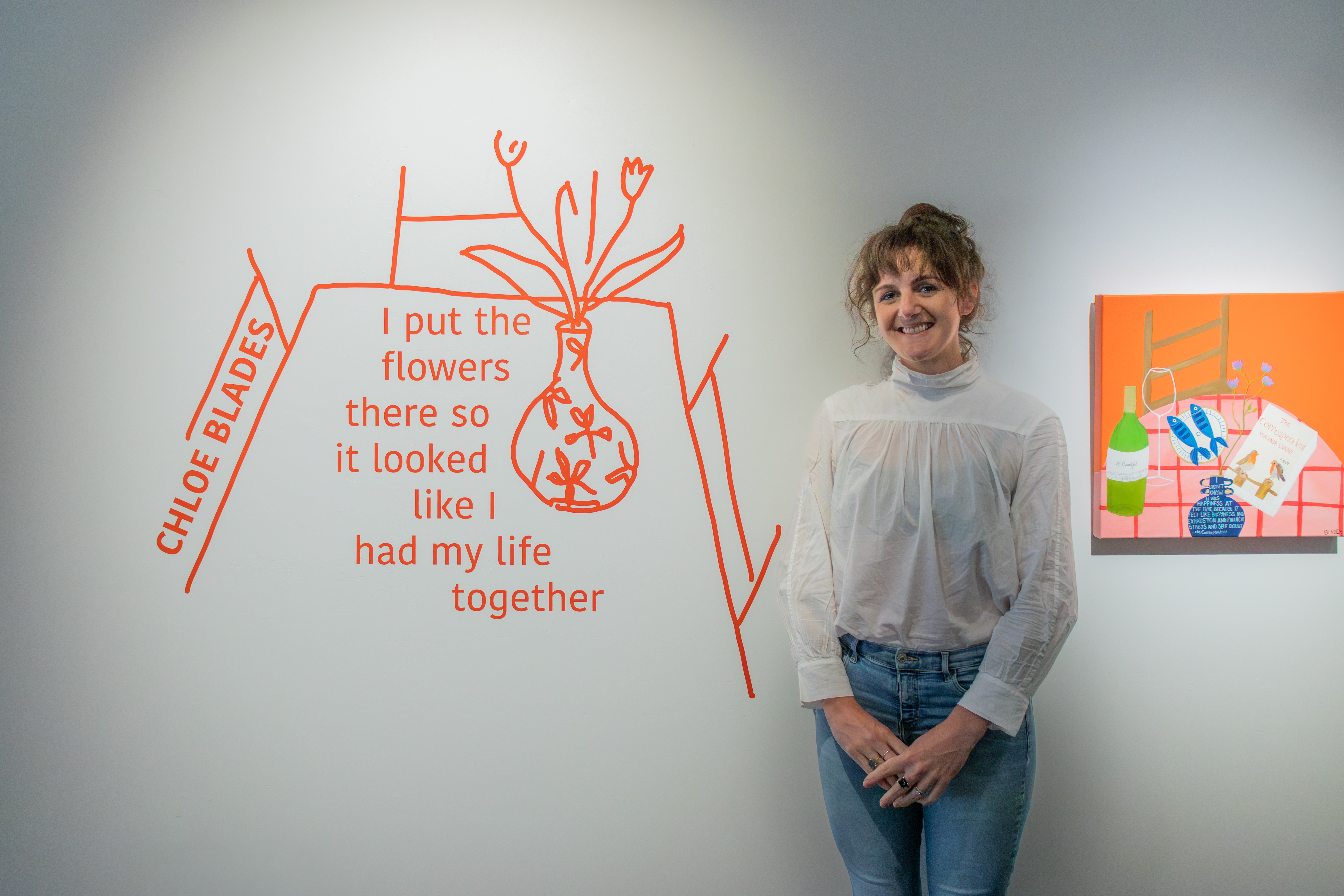 Artist Chloe Blades stands with her artwork at He Waka Tuia in Invercargill