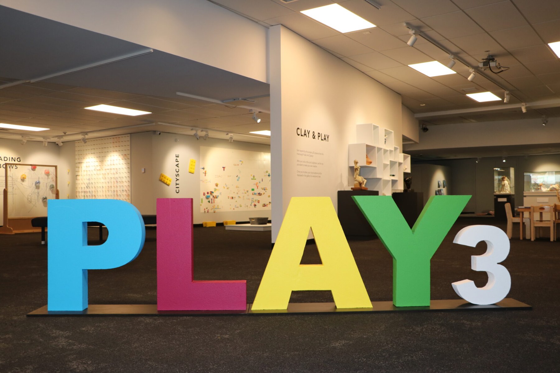 Photo of colourful letters spelling out the word PLAY 3.
